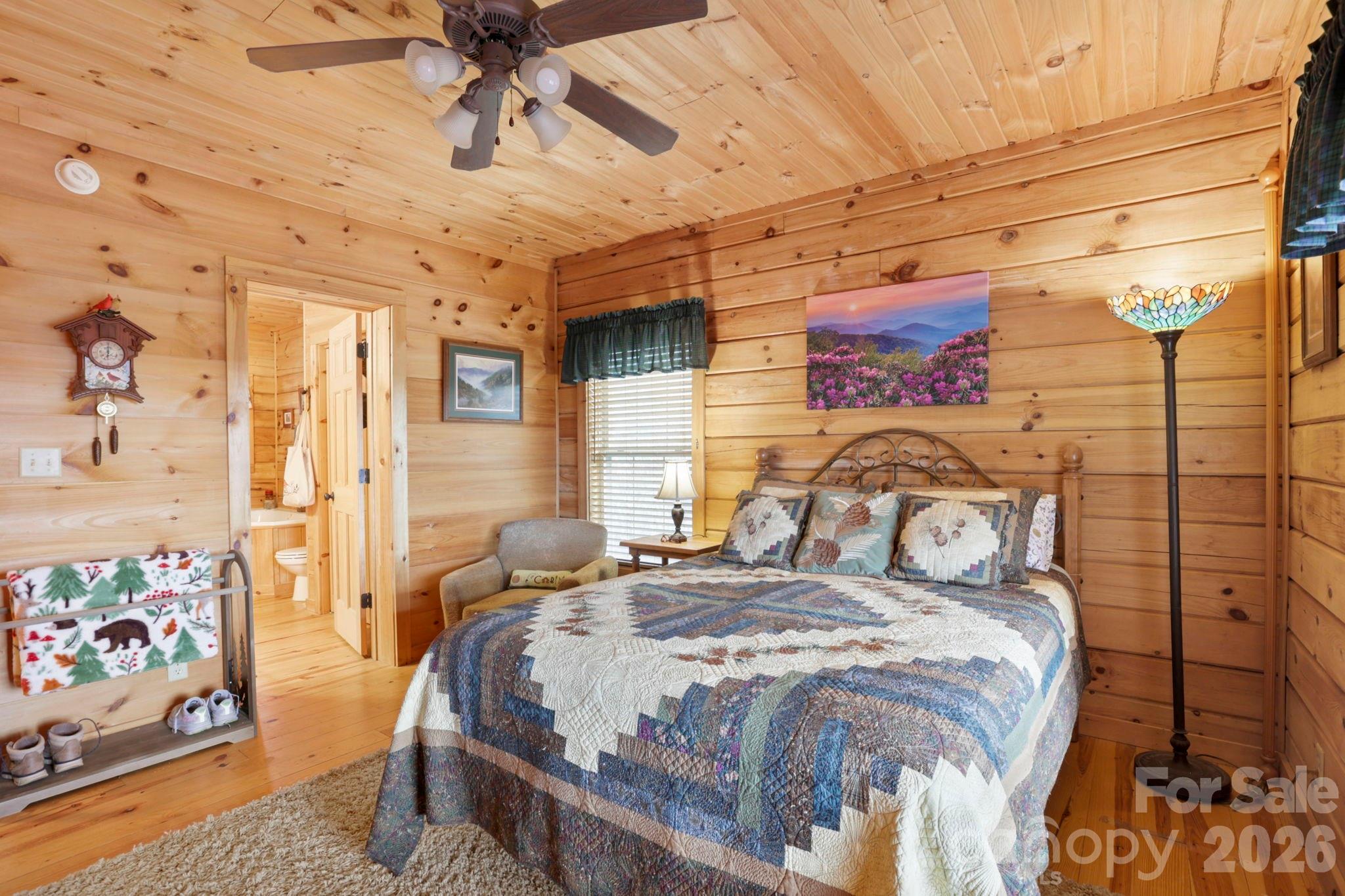 78 Longview Ridge Lake Toxaway, NC 28747 - Photo 19 of 43 a bed sitting in a bedroom next to a window