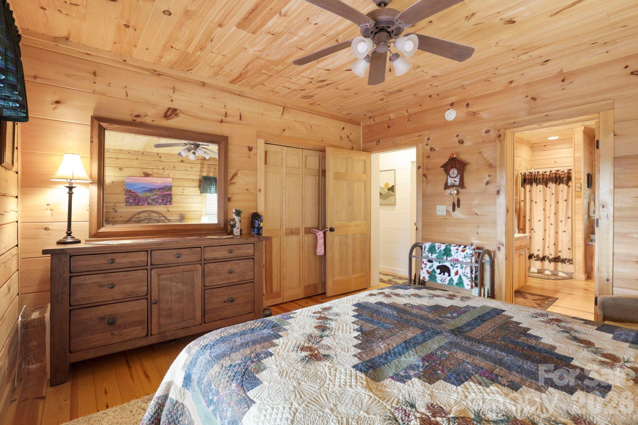 78 Longview Ridge Lake Toxaway, NC 28747 - Photo 20 of 43 a bedroom with a bed and a large window