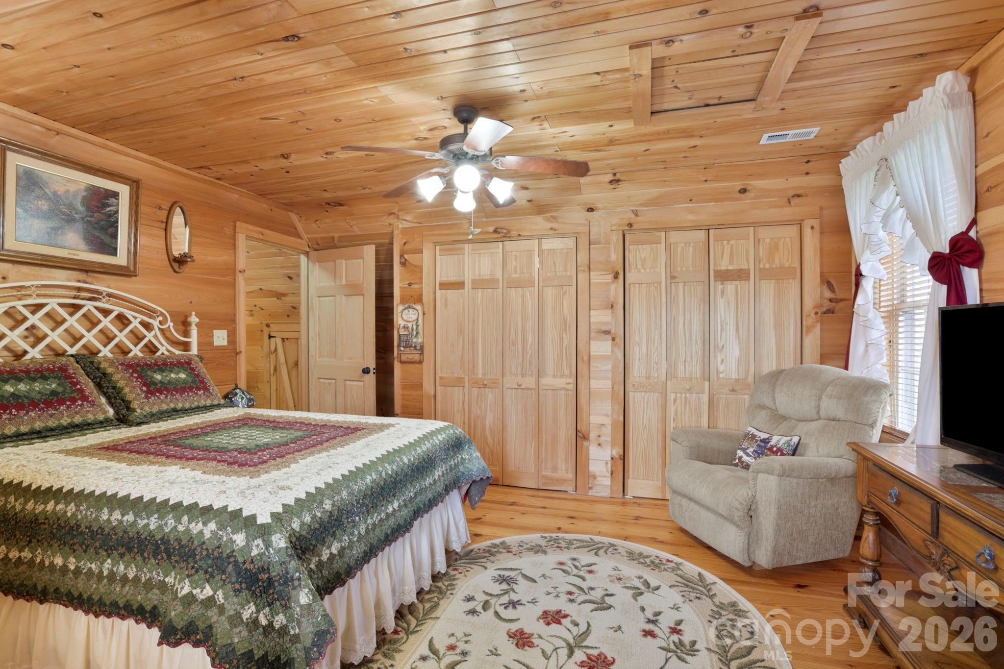 78 Longview Ridge Lake Toxaway, NC 28747 - Photo 27 of 43 a bedroom with a bed and a couch