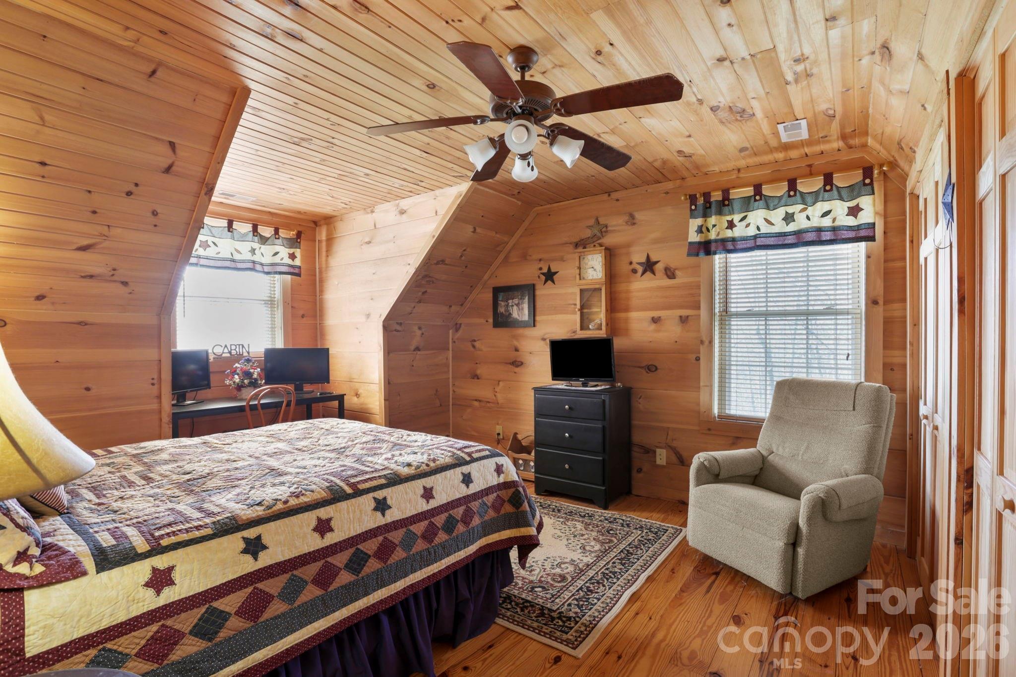 78 Longview Ridge Lake Toxaway, NC 28747 - Photo 29 of 43 a living room with furniture and a fireplace