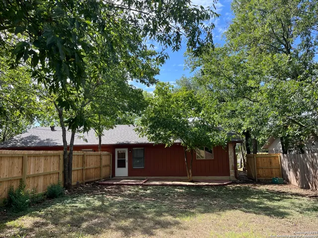 a view of a house with a tree