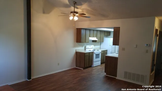 wooden floor in an empty room with a mirror
