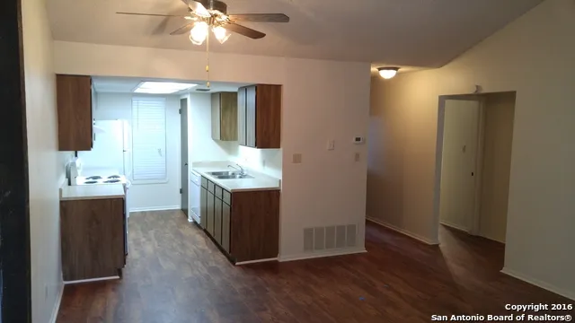 a bathroom with a sink vanity and a mirror