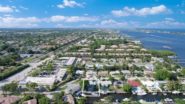 an aerial view of residential building with green space