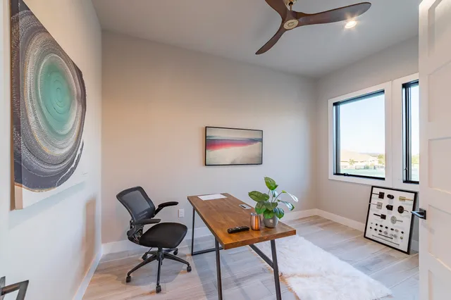 a view of a workspace with furniture