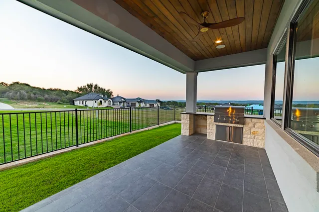 a view of a swimming pool with a big yard