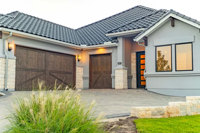 a front view of a house having yard