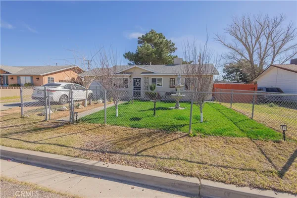 a house view with a backyard space