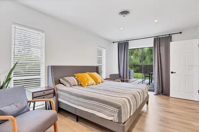 a bedroom with a bed and a couch