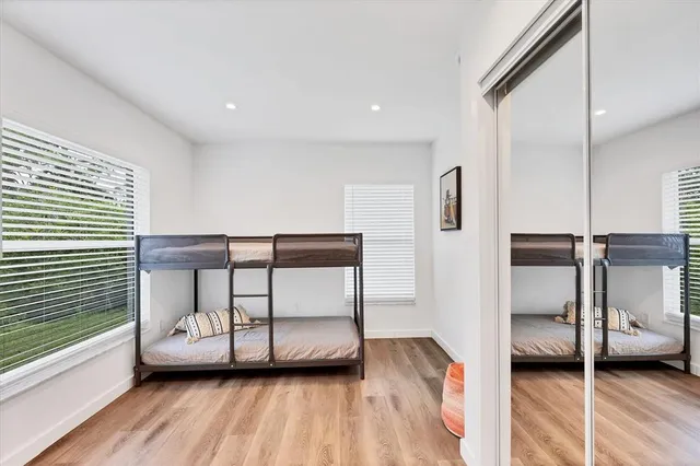 a view of a bedroom with furniture and a window