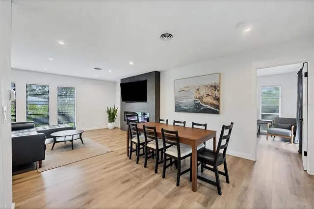 a view of a dining room with furniture window and wooden floor