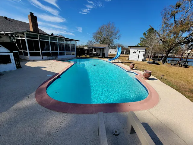 a view of a swimming pool with a lounge chairs
