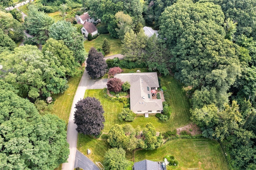 an aerial view of a house with swimming pool