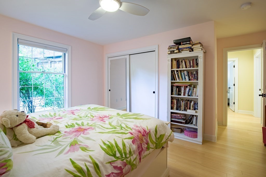 671 Salem End Road Framingham, MA 01702 - Photo 20 of 41 a bedroom with a bed and a book shelf