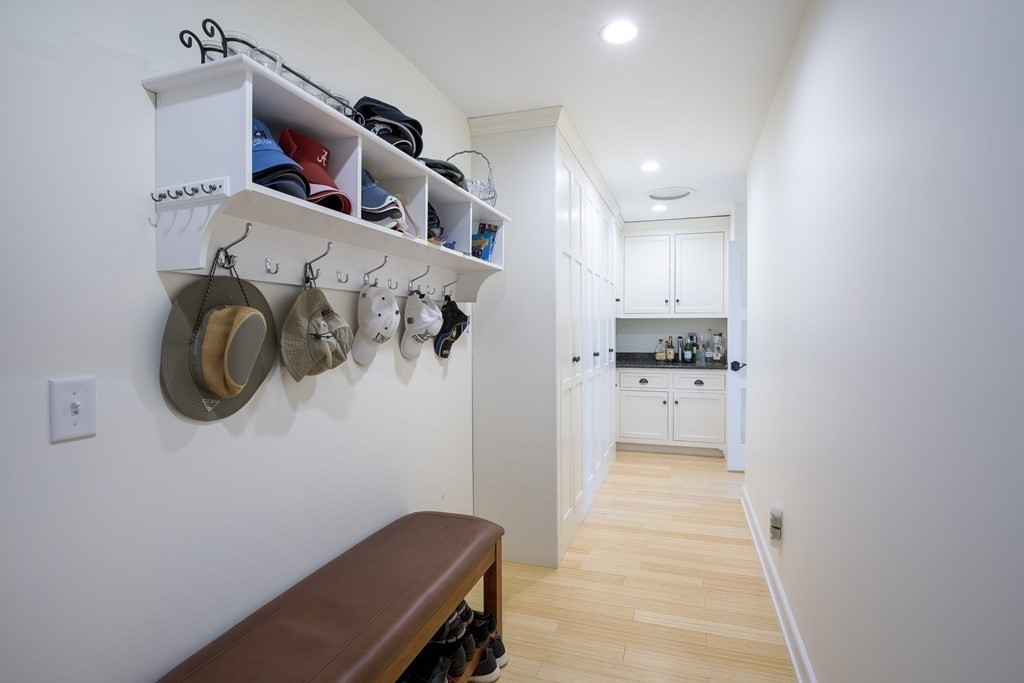 671 Salem End Road Framingham, MA 01702 - Photo 23 of 41 a view of a kitchen with a fridge and wooden floor