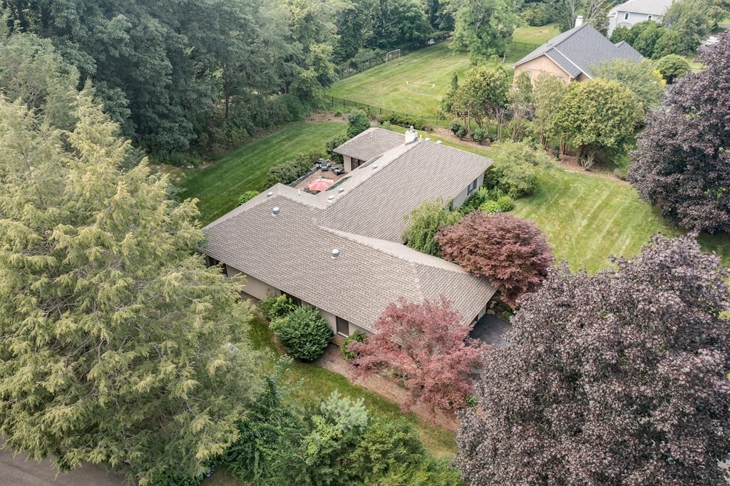 671 Salem End Road Framingham, MA 01702 - Photo 3 of 41 an aerial view of a house with a yard and lake view