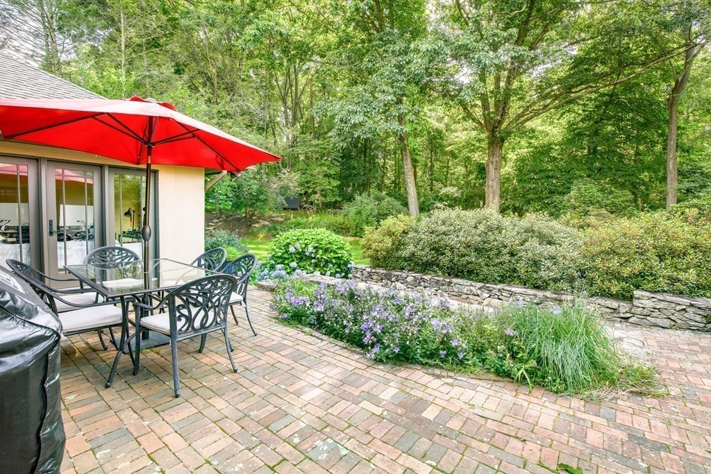671 Salem End Road Framingham, MA 01702 - Photo 34 of 41 an outdoor space with furniture and umbrella