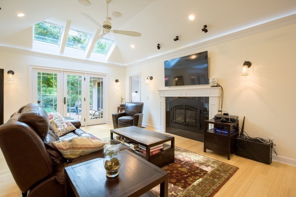 671 Salem End Road Framingham, MA 01702 - Photo 8 of 41 a living room with furniture and a fireplace
