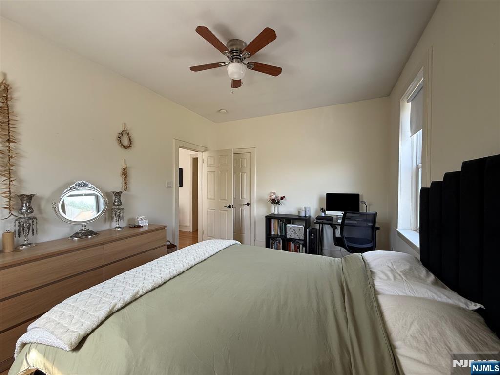 215 Orient Way, Unit C2 Rutherford, NJ 07070 - Photo 17 of 25 a bedroom with bed and chair