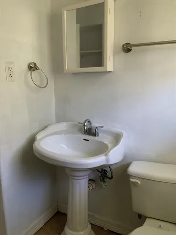 a bathroom with a sink and mirror