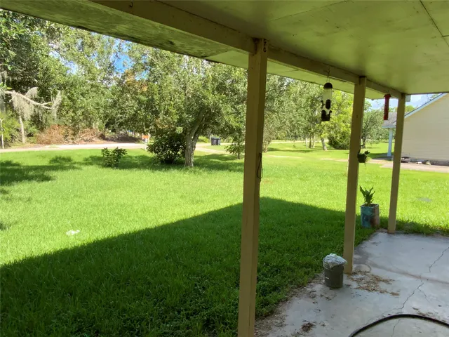 a view of a porch with a backyard