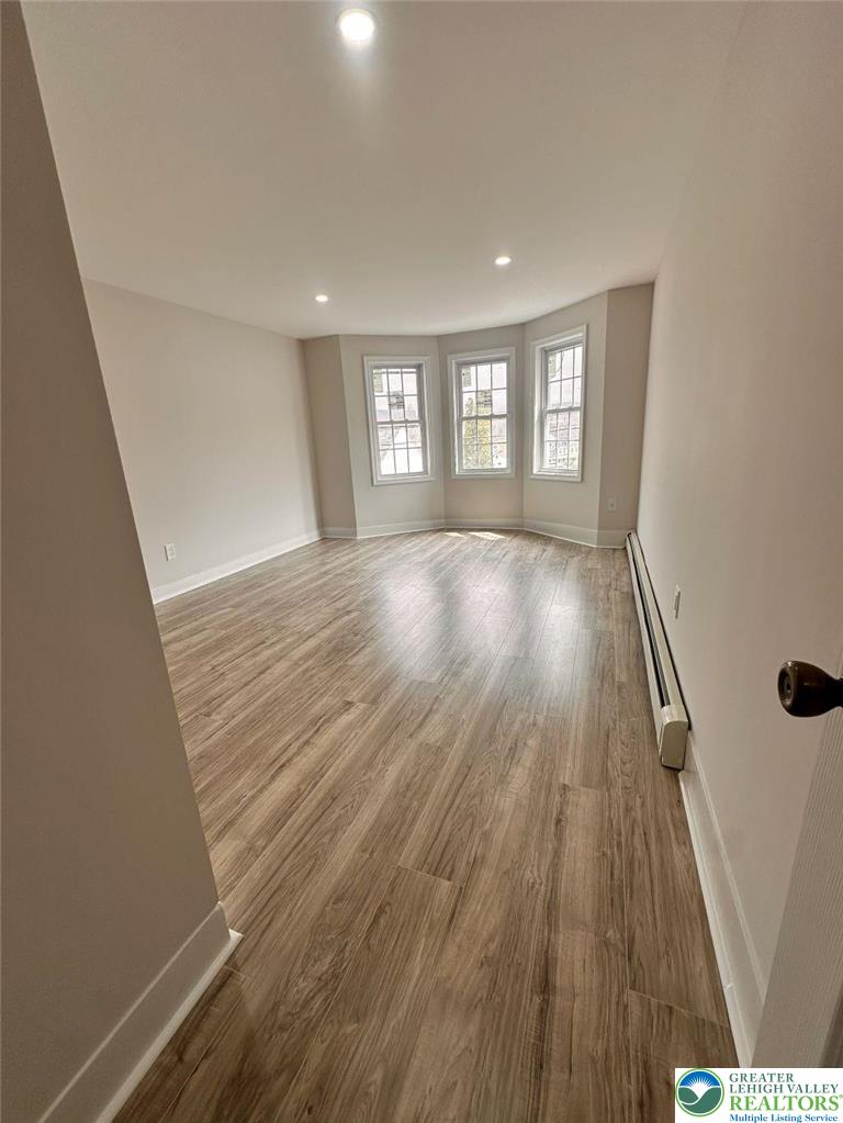 44 South Locust Street Mount Carmel, PA 17851 - Photo 11 of 18 wooden floor in an empty room with a window