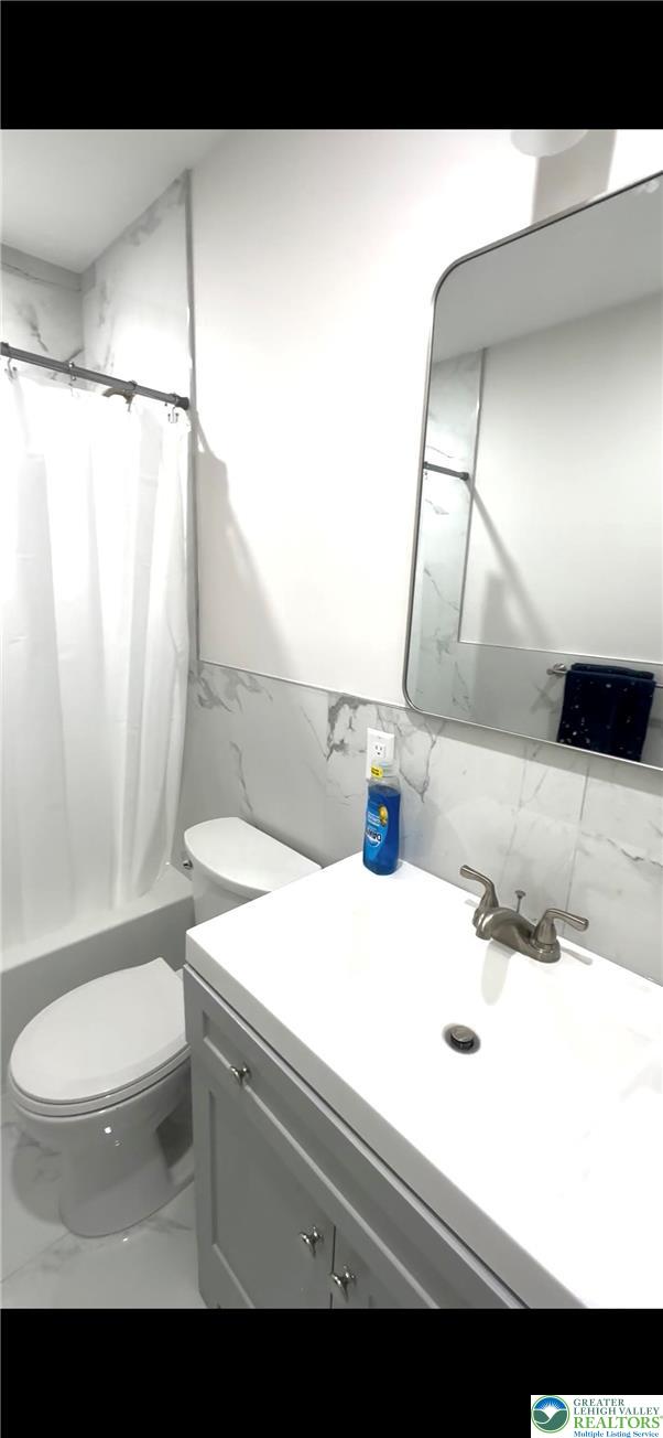 44 South Locust Street Mount Carmel, PA 17851 - Photo 12 of 18 a bathroom with a sink a toilet and shower