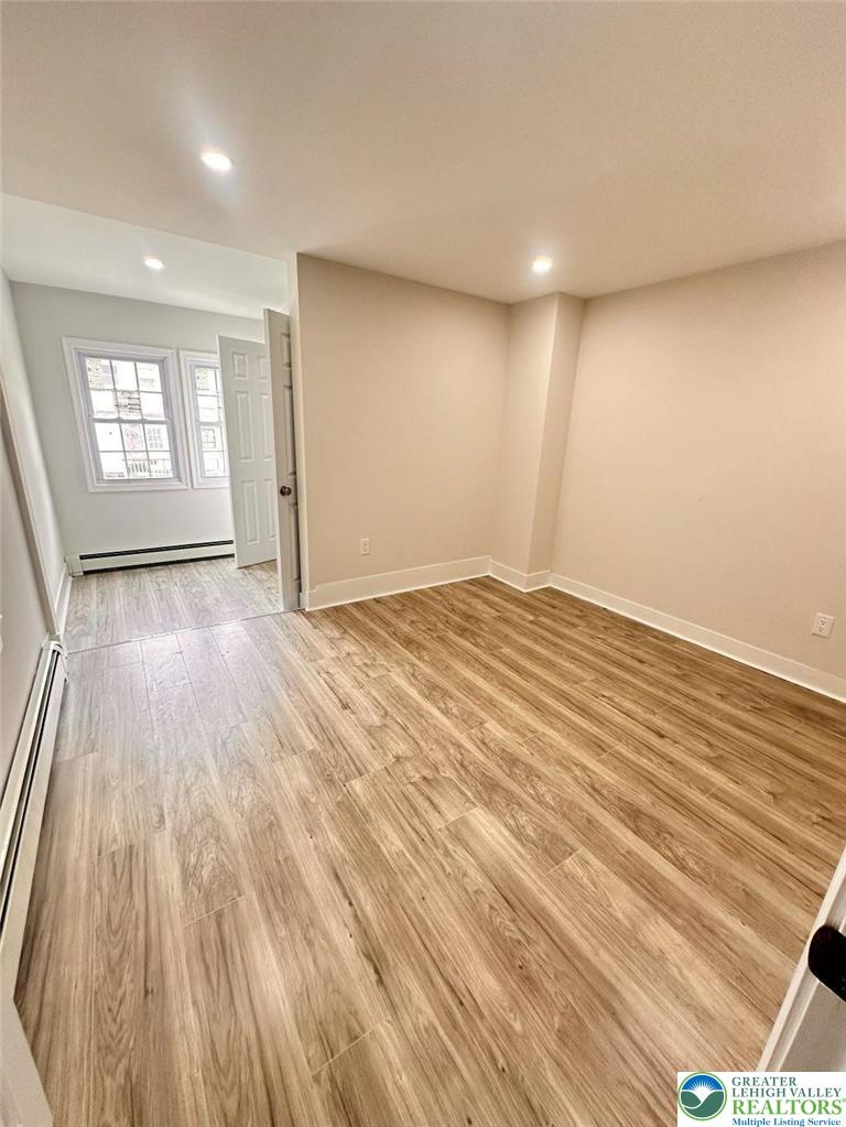 44 South Locust Street Mount Carmel, PA 17851 - Photo 7 of 18 an empty room with wooden floor and windows