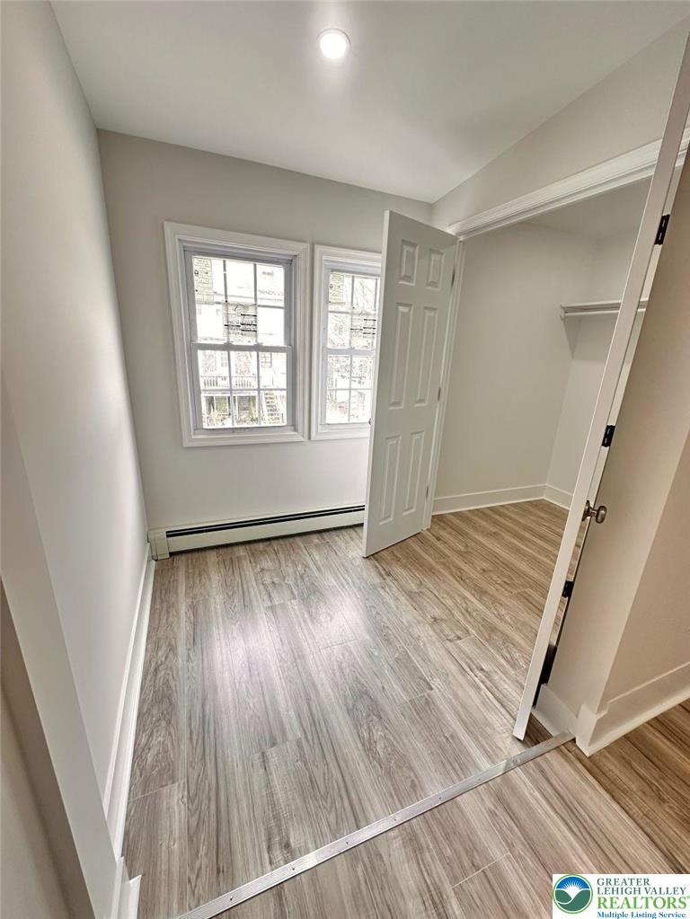 44 South Locust Street Mount Carmel, PA 17851 - Photo 9 of 18 a view of an empty room with wooden floor and a window