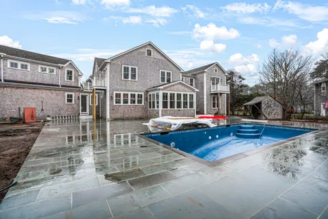 an aerial view of a house with a yard