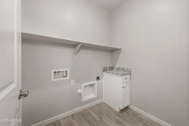 a view of a storage and utility room with closet
