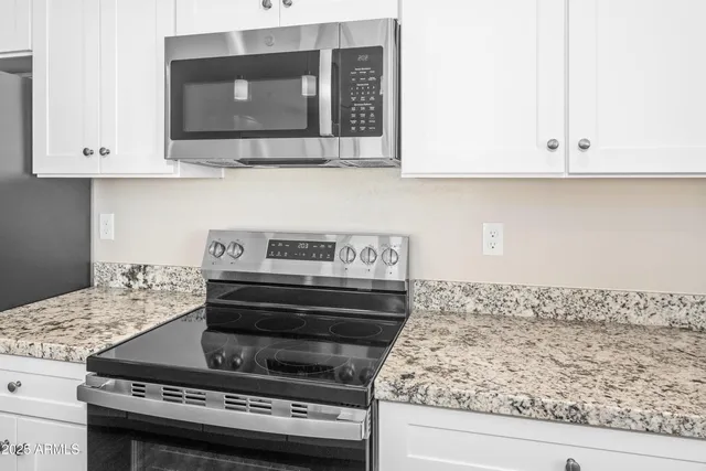 a kitchen with a stove and a microwave