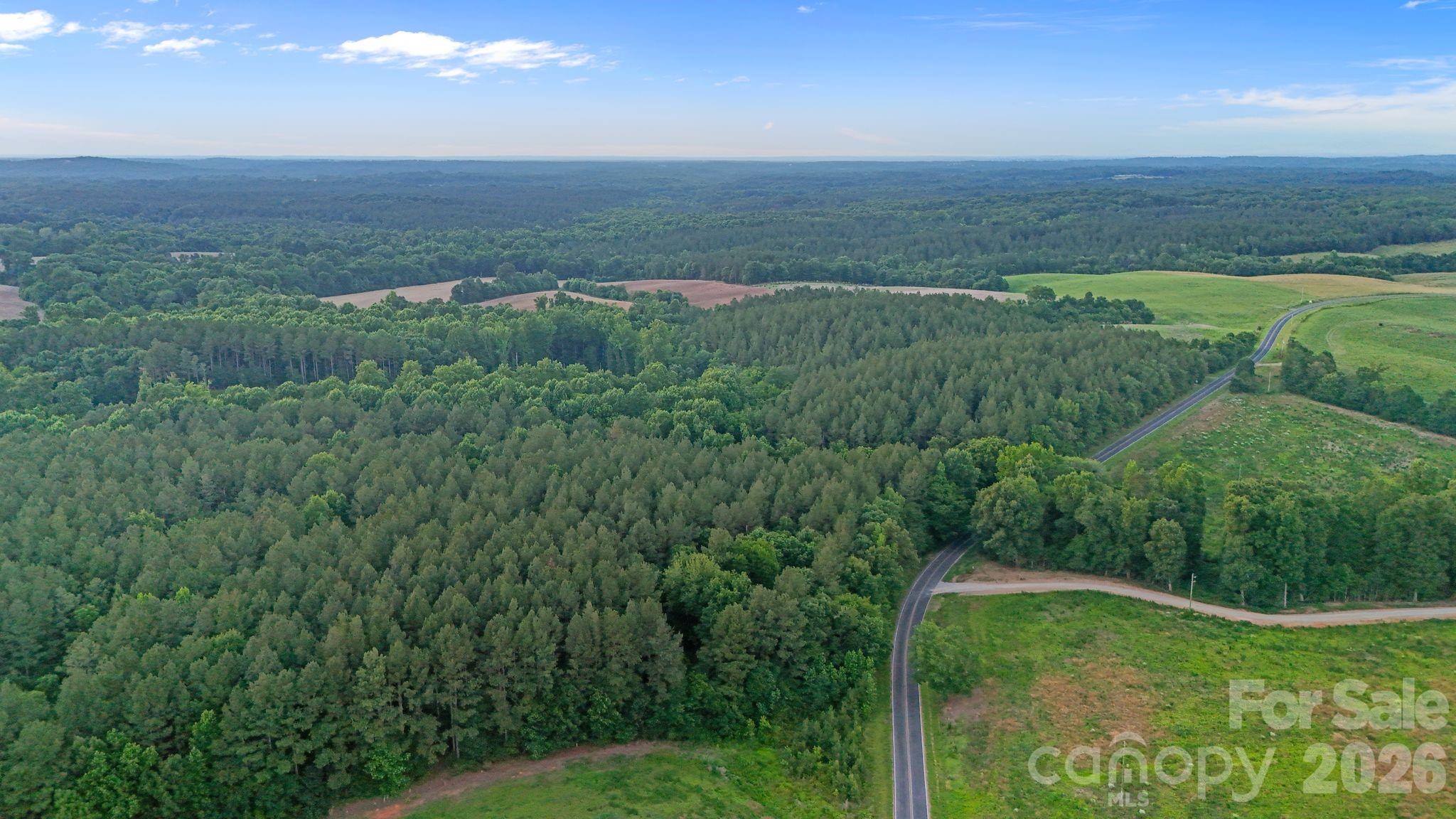 0 Lucy Short Cut Road, Unit 2 Marshville, NC 28103 - Photo 7 of 38 a view of an outdoor space and a yard