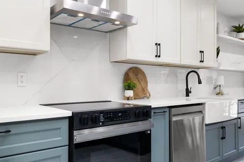 a kitchen with a stove and a sink