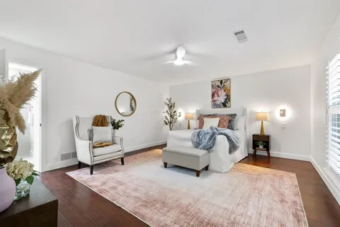 a bed room with furniture and a chandelier