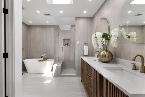 a bathroom with a double vanity sink and a mirror