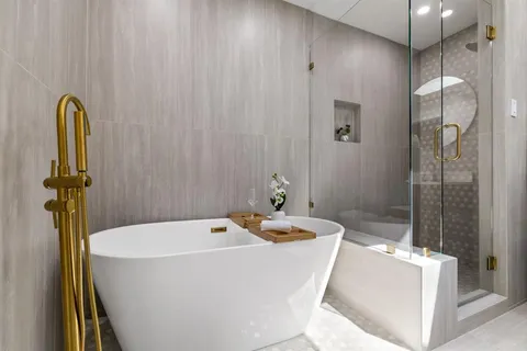 a bathroom with a sink a bathtub and shower