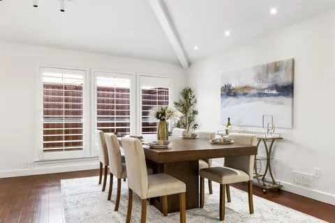 a view of a dining room with furniture and window