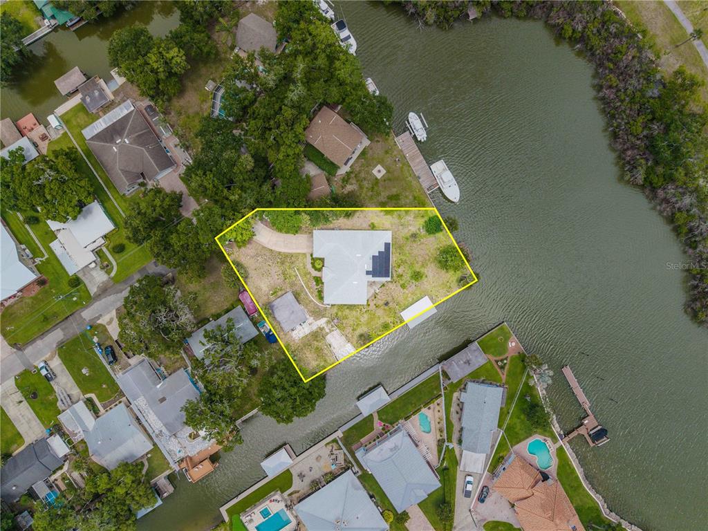 192 Azalea Road Edgewater, FL 32141 - Photo 88 of 94 an aerial view of a house with a lake view