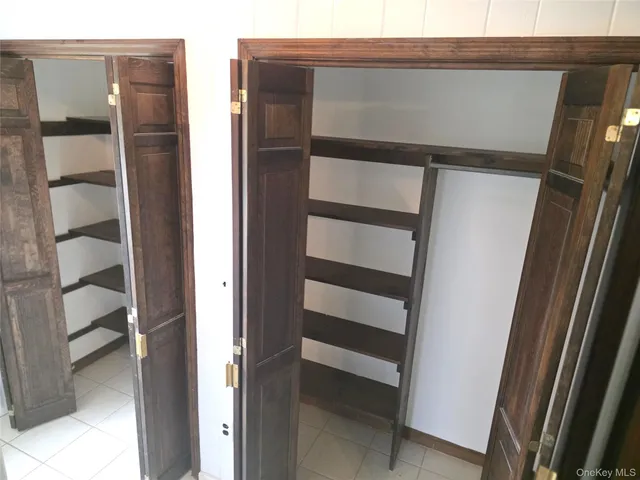 a view of an empty room with a fireplace