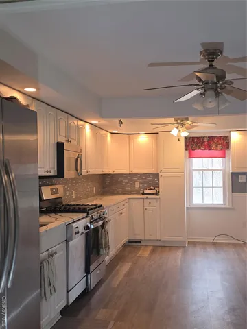 a kitchen with a sink and a refrigerator