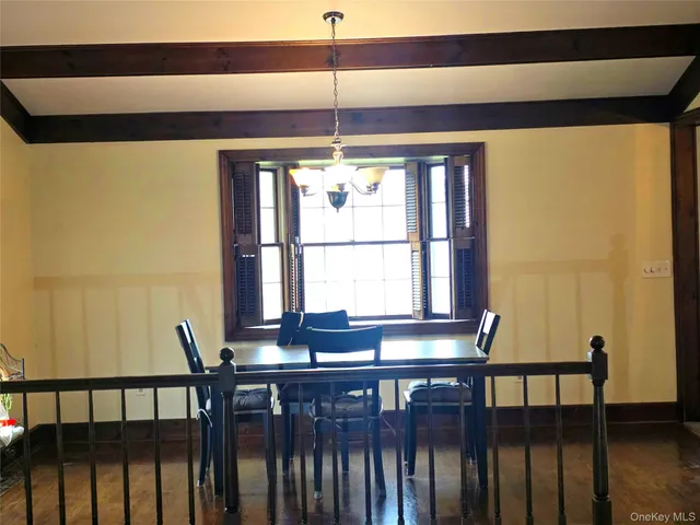 a view of wooden floor and a window