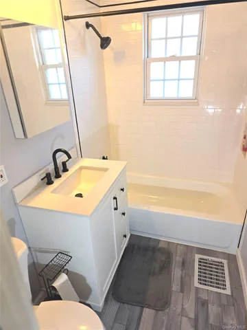 a bathroom with a sink and mirror