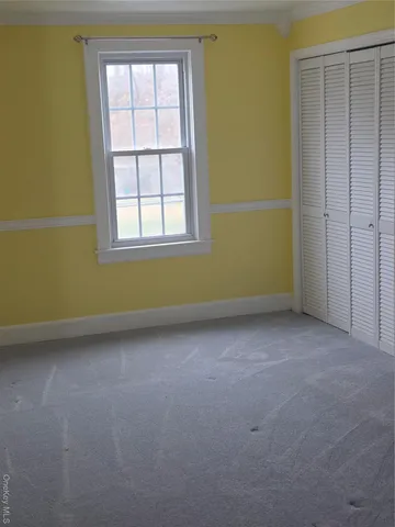 a view of room with walk in closet