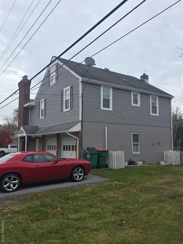a house view with a garden space
