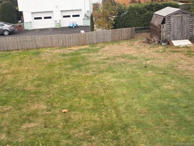 a view of a backyard of the house