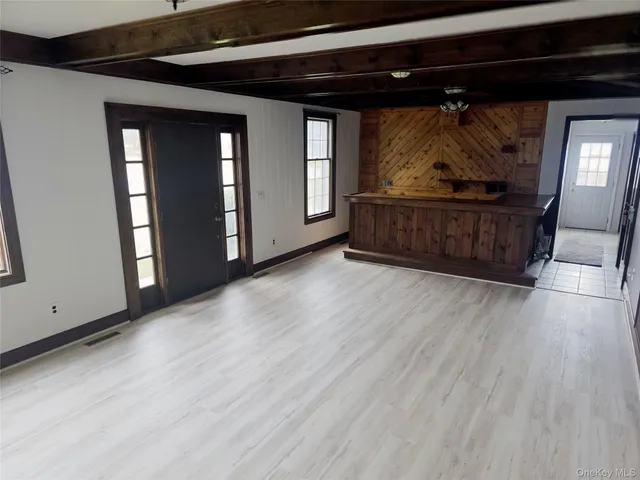 a view of room with wooden floor