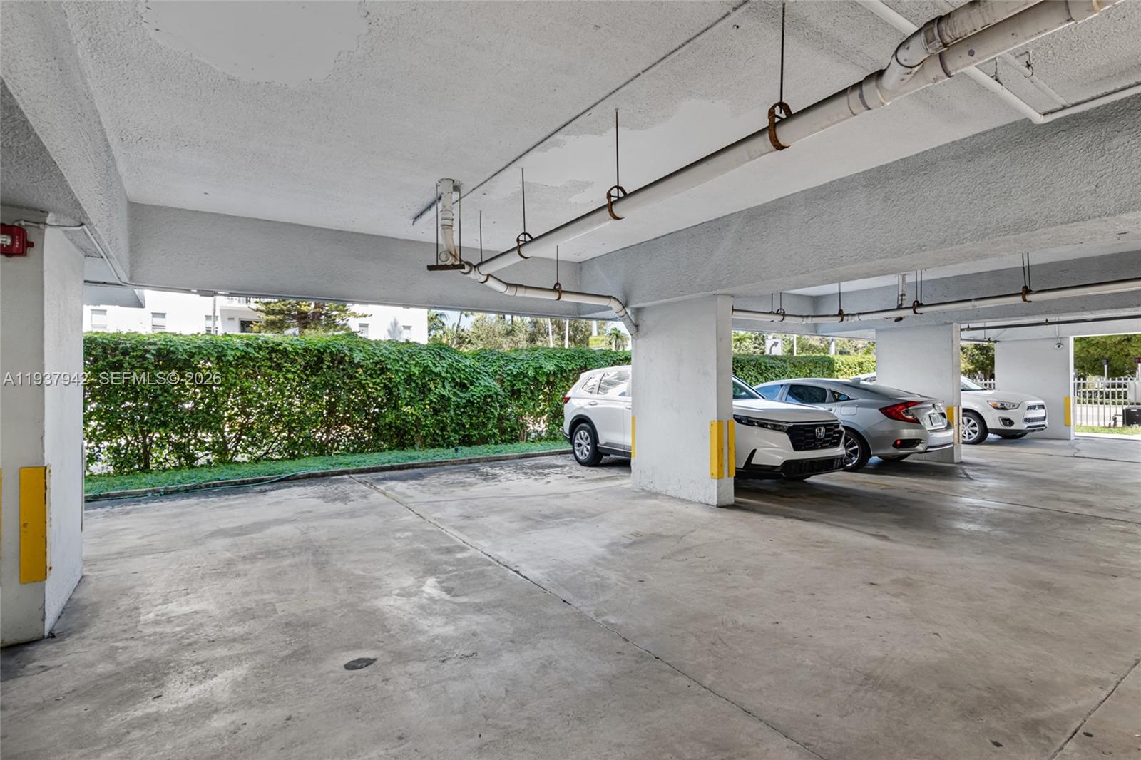 1250 Alton Road, Unit 3A Miami Beach, FL 33139 - Photo 20 of 25 a view of parking garage with cars
