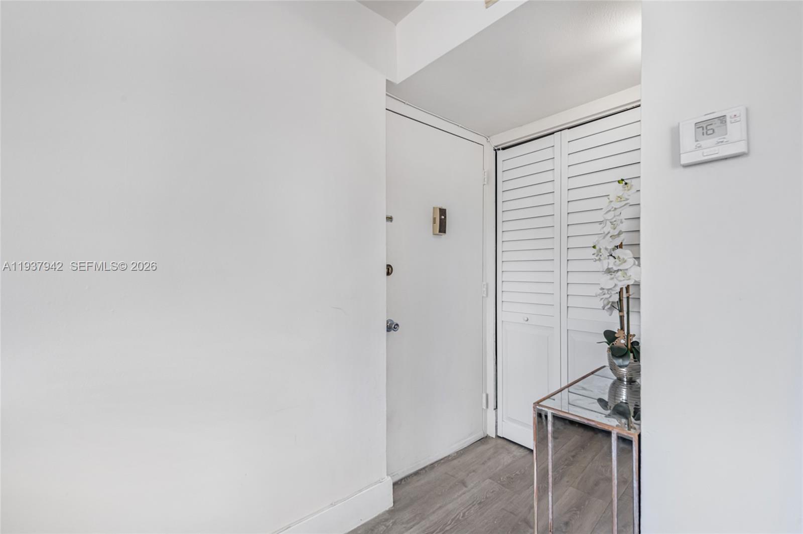 1250 Alton Road, Unit 3A Miami Beach, FL 33139 - Photo 5 of 25 a view of a hallway with wooden floor and entryway