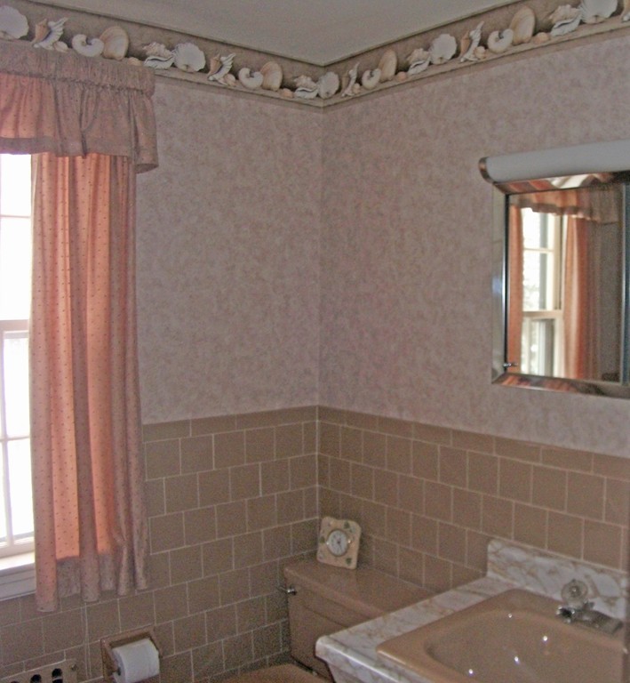 19 Churchill Road Boston, MA 02132 - Photo 17 of 17 a bathroom with a shower and a sink